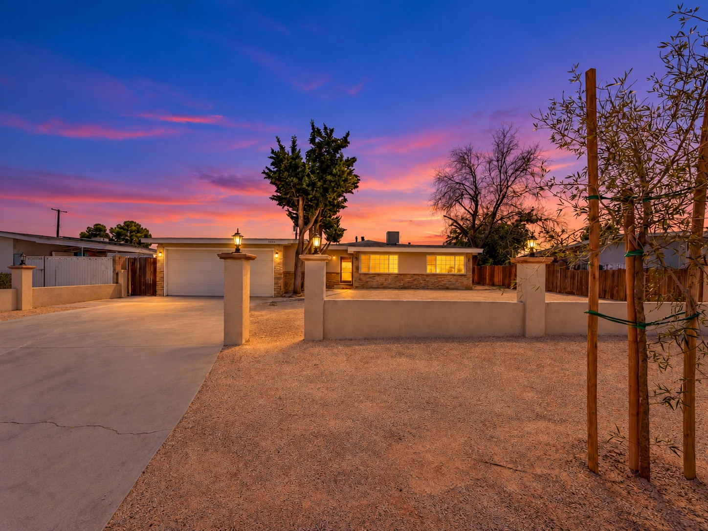 Twilight front exterior of 38878 Sage Tree Street in Palmdale, California